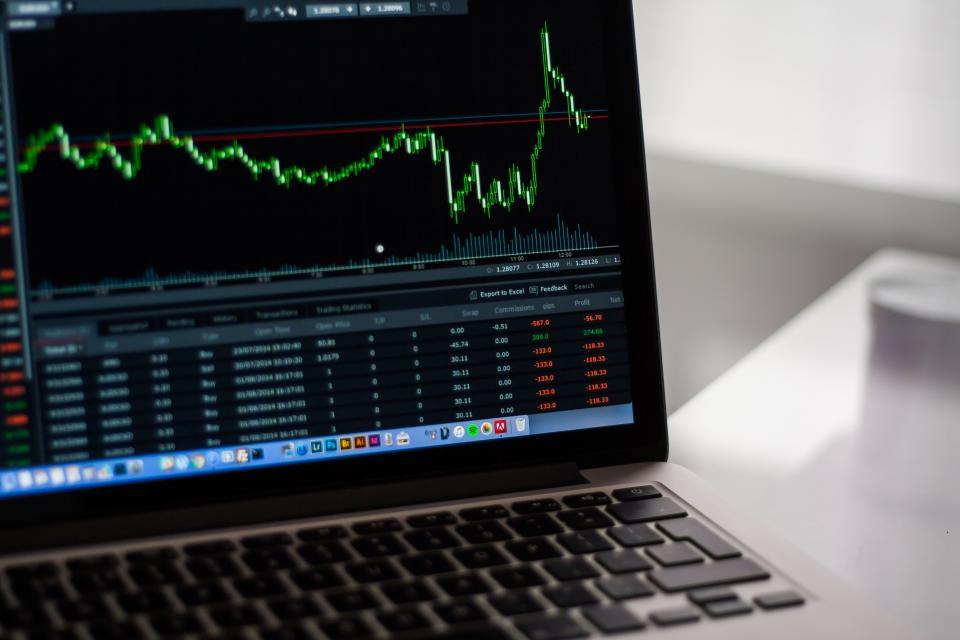 Laptop showing financial charts